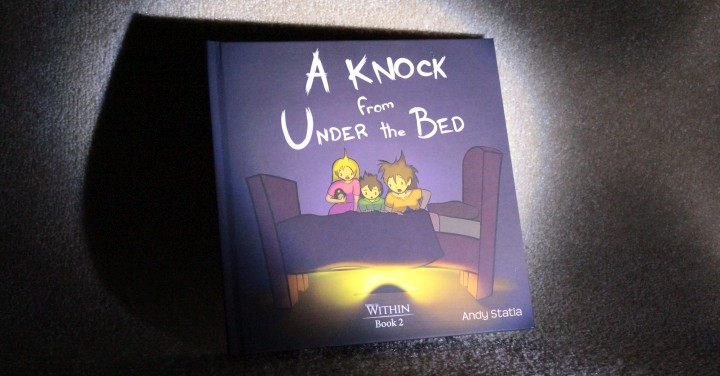 A photo of the book sitting in the dark